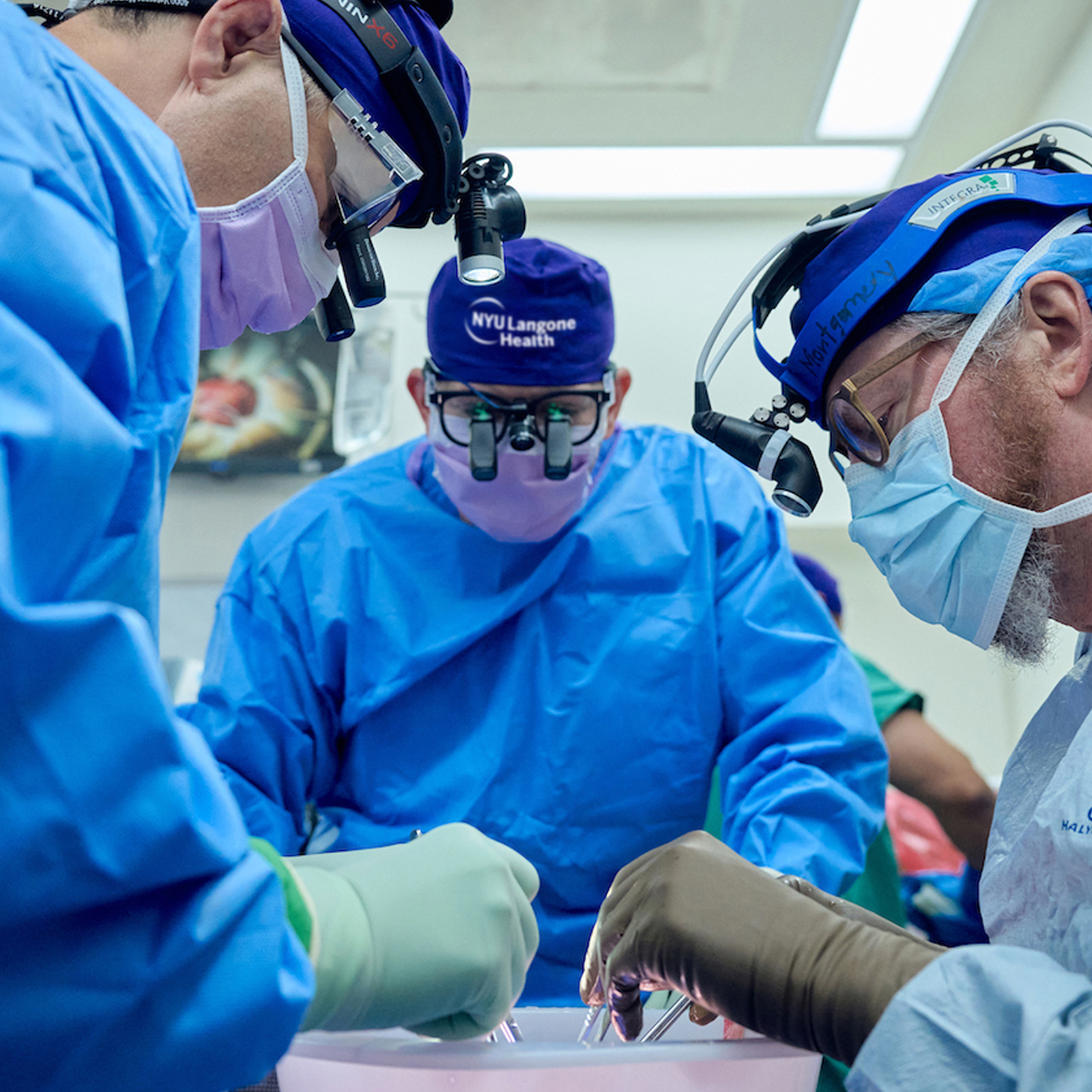 Surgeons operating on a patient