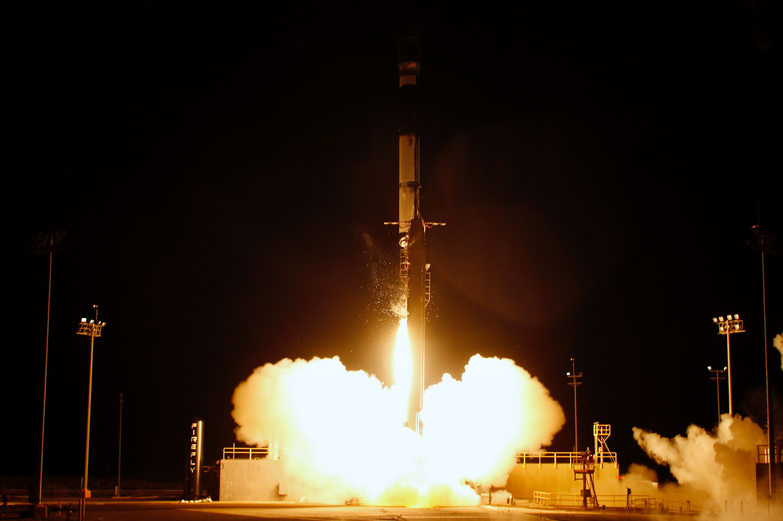 A rocket with smoke coming out of it during a space launch.