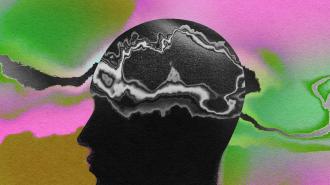 A silhouette of a person's head with a colorful background.