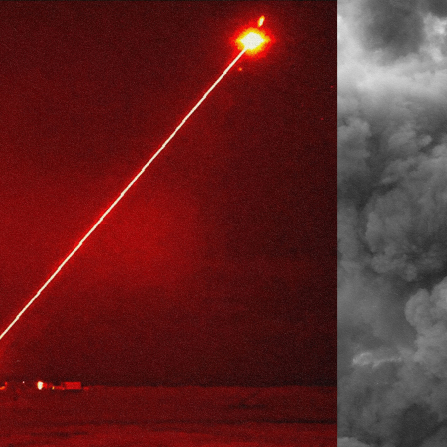 an image of the laser weapon firing a red beam at an object in the sky