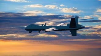 A drone, enhanced with military AI, soars in the sky against a sunset and cloud-filled backdrop reflecting the innovative spirit of Silicon Valley.