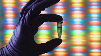 A gloved hand holds a small vial against a vibrant genome sequencing pattern, highlighting the marvels of modern biology.